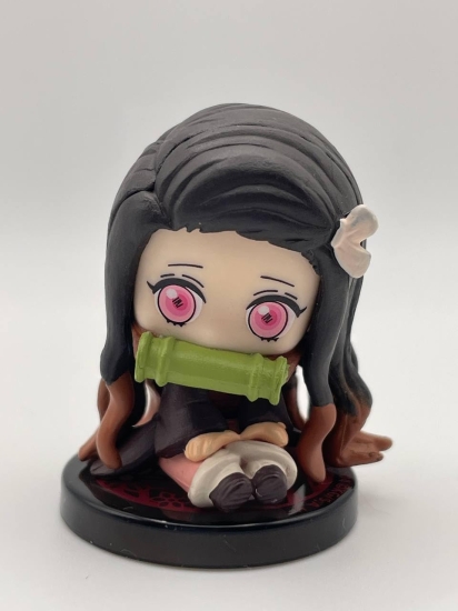 Demon Slayer - Nezuko Kamado. ( Nezuko sitting with her iconic bamboo muzzle )mini action figure 